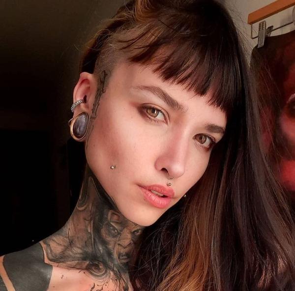 model wearing amethyst and gold ear weights