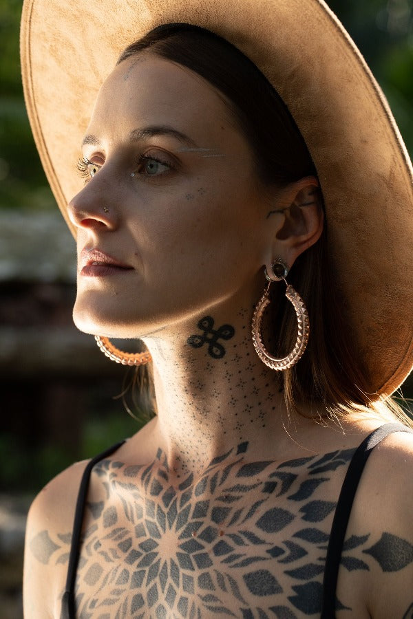 22k rose gold plated brass earrings - weights - Journey on model wearing tunnels