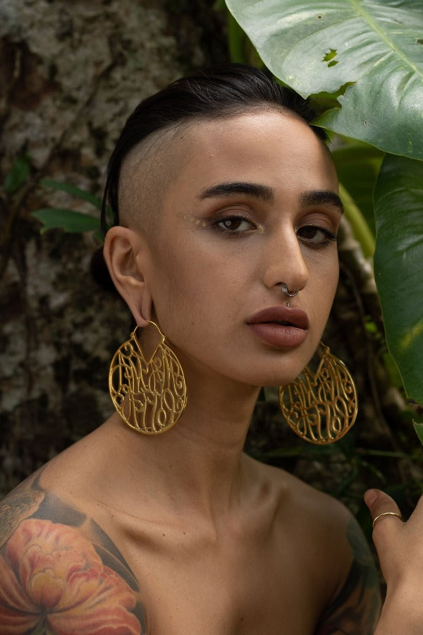 22k yellow gold plated brass earrings - ear weights - Mamacita on model with stretched ears