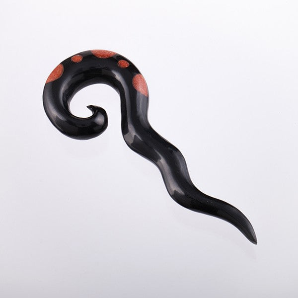 Serpent like horn ear stretcher inlaid with coral