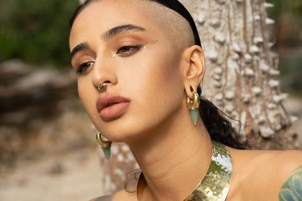 Magnetic brass ear weights with Jade stone on model with stretched ears