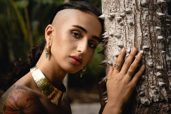 Magnetic brass ear weights with Jade stone on model with stretched ears
