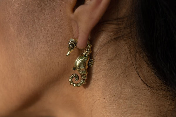 Brass ear weights - Sea Horse on model with stretched ears 