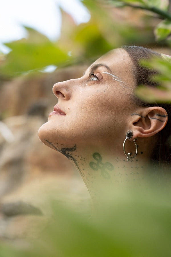Stainless steel ear tunnel - Triangle Dotwork in model wearing earrings
