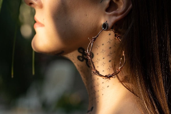 Stainless steel tunnels silver colour - Dotted Halo on model wearing earrings