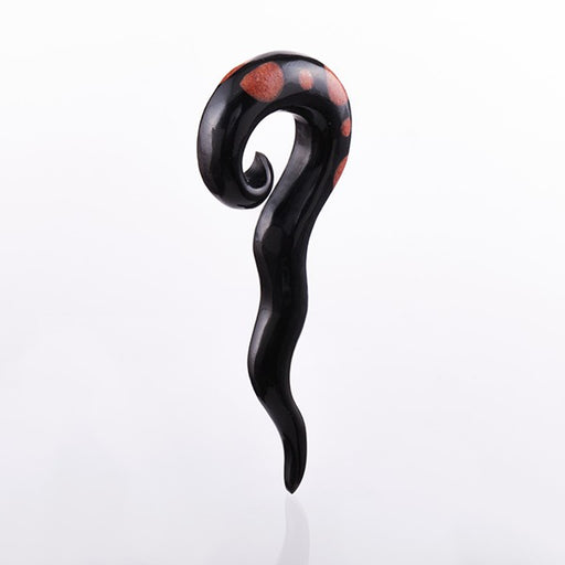 Serpent like horn ear stretcher inlaid with coral