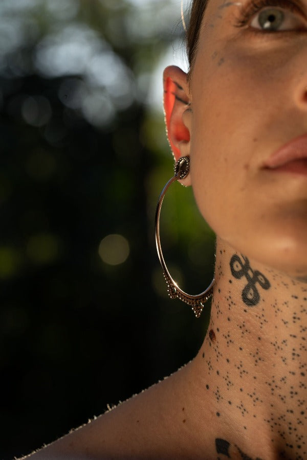 Stainless steel tunnels silver colour - Dotted Halo on model wearing earrings